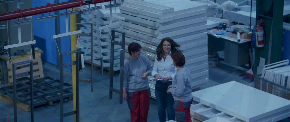 Trainees in a production hall