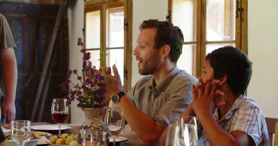 Robert Marshall at a table with winemakers